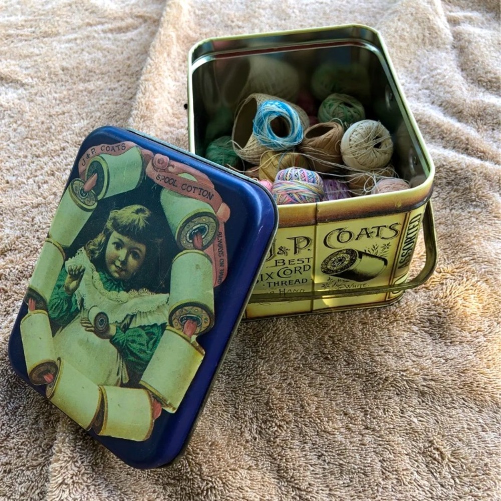 Antique box with  sewing threads